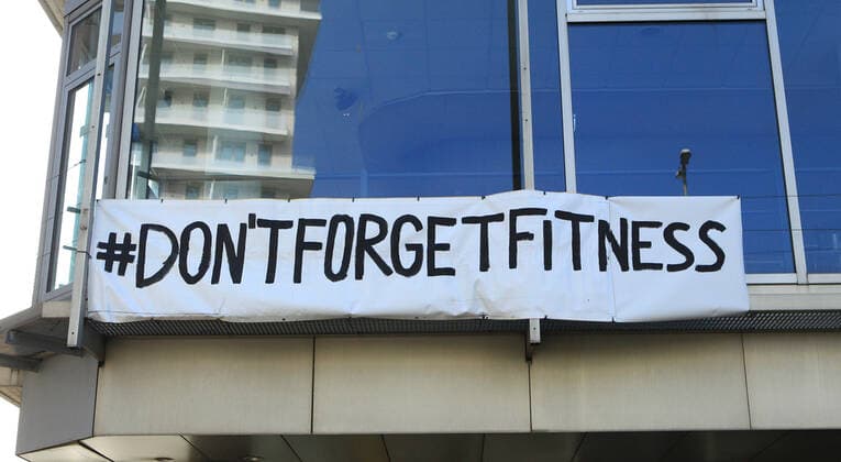On the facade of a studio of the chain McFit, closed because of the lockdown, a poster with a call for help is attached Borgfelde Hamburg