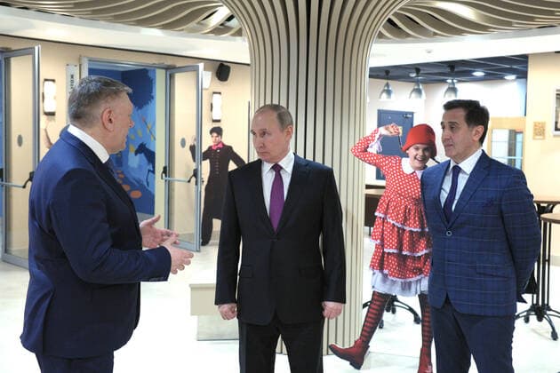 MOSCOW, RUSSIA - MARCH 25, 2021: Russia s President Vladimir Putin (C), Alexander Fyodorov (L) and Mayrbek Matayev, Artistic Director and Ballet Master of the Children s Musical Theatre of Youth Acting respectively, visit the theatre s new building to mark Cultural Worker s Day celebrated in Russia on March 25. Mikhail Klimentyev Russian Presidential Press and Information Office TASS  TS0FA796