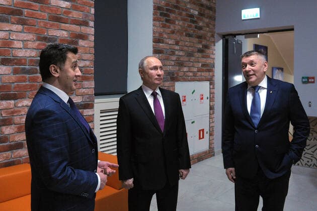 MOSCOW, RUSSIA - MARCH 25, 2021: Russia s President Vladimir Putin (C), Mayrbek Matayev (L) and Alexander Fyodorov, Ballet Master and Artistic Director of the Children s Musical Theatre of Youth Acting respectively, visit the theatre s new building to mark Cultural Worker s Day celebrated in Russia on March 25. Mikhail Klimentyev Russian Presidential Press and Information Office TASS  TS0FA79C