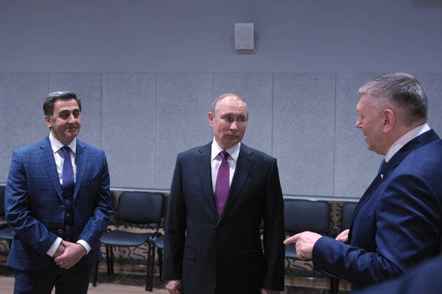 MOSCOW, RUSSIA - MARCH 25, 2021: Russia s President Vladimir Putin (C), Mayrbek Matayev (L) and Alexander Fyodorov, Ballet Master and Artistic Director of the Children s Musical Theatre of Youth Acting respectively, visit the theatre s new building to mark Cultural Worker s Day celebrated in Russia on March 25. Mikhail Klimentyev Russian Presidential Press and Information Office TASS  TS0FA79D