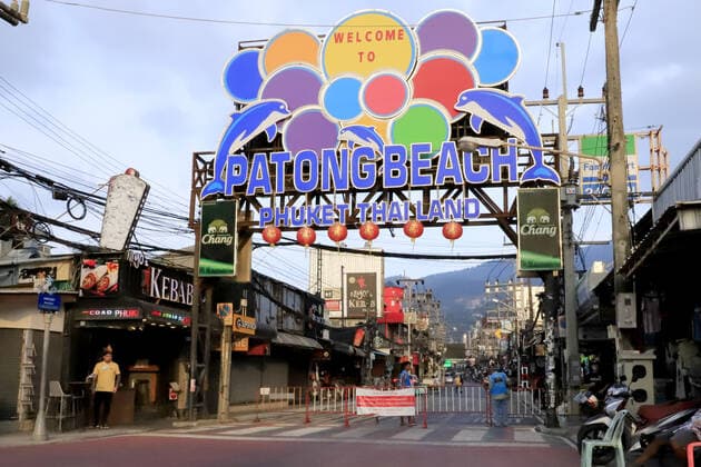 PHUKET, THAILAND â€“ MARCH 21, 2021: A cordon in Patong Beach Street in Patong, on Phuket during the COVID-19 pandemic. On 26 March 2020, Thailandâ€™s prime minister Chan-o-cha introduced entry restrictions for foreign nationals, which suspended most commercial flights to the country, due to the COVID-19 pandemic. With the restrictions in place for a year, Thailandâ€™s tourism revenues have dropped from 63.1 bn to 10.96 bn US dollars. Thailandâ€™s government has decided to exempt tourists arriving to Phuket from travel quarantine as long as they have been vaccinated against COVID-19, starting from 1 July 2021. Grigory Zimenkov TASS  TS0FA8C4