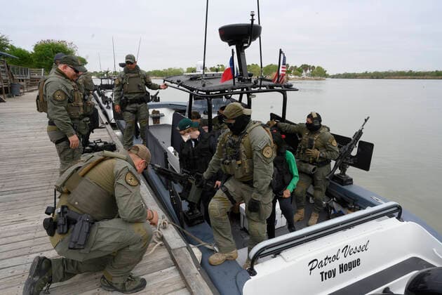 March 26, 2021, Granejo, Texas, USA: Texas DPS troopers wait as a delegation of eighteen U.S. Senators prepares to tour the Rio Grande River south of Mission in four Texas Dept. of Public Safety gunboats at the end of a whirlwind tour of south Texas. The senators saw an overcrowded migrant processing center in Donna and a corpse floating in the river north of Anzalduas Park. Granejo USA - ZUMAd150 20210326_znp_d150_029 Copyright: xBobxDaemmrichx