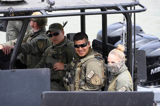 March 26, 2021, Granejo, Texas, USA: Texas DPS troopers wait as a delegation of eighteen U.S. Senators prepares to tour the Rio Grande River south of Mission in four Texas Dept. of Public Safety gunboats at the end of a whirlwind tour of south Texas. The senators saw an overcrowded migrant processing center in Donna and a corpse floating in the river north of Anzalduas Park. Granejo USA - ZUMAd150 20210326_znp_d150_031 Copyright: xBobxDaemmrichx
