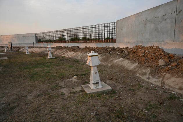 March 26, 2021, Granejo, Texas, USA: Machinery and construction material including rebar sit idle and untouched yards from the Rio Grande River south of Mission where a section of the U.S.-Mexico border wall sits incomplete. This section would isolate the Chimney s RV Park and historical La Lomita Chapel on the Mexican side of the wall. Granejo USA - ZUMAd150 20210326_znp_d150_063 Copyright: xBobxDaemmrichx