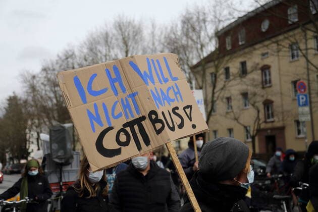 A demonstrator with sign I dont want to go to Cottbus during a demonstration against rent madness and displacement in Potsdam, 27 March 2021 Housing Action Day in Potsdam