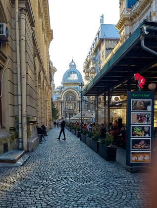 Old town with restaurants and bars with tourists and local people in Bucharest, Romania on March 27, 2021.
