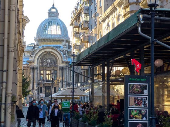 Old town with restaurants and bars with tourists and local people in Bucharest, Romania on March 27, 2021.