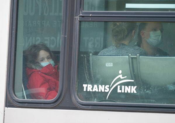 March 27, 2021, Vancouver, BC, Canada: People speak to members of Victim Services on a bus outside of the Lynn Valley Library, in North Vancouver, B.C., Saturday, March 27, 2021. Police say multiple victims were stabbed inside and outside the library today. Vancouver Canada  - ZUMAc35_ 20210327_zaf_c35_076 Copyright: xJonathanxHaywardx