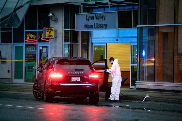 March 27, 2021, North Vancouver, BC, Canada: A forensics police officer collects evidence outside the entrance to the Lynn Valley Library, in North Vancouver, B.C., Saturday, March 27, 2021. A woman is dead and six others injured following an attack on Saturday that police said they were trying to determine a motive for. North Vancouver Canada  - ZUMAc35_ 20210327_zaf_c35_108 Copyright: xDarrylxDyckx
