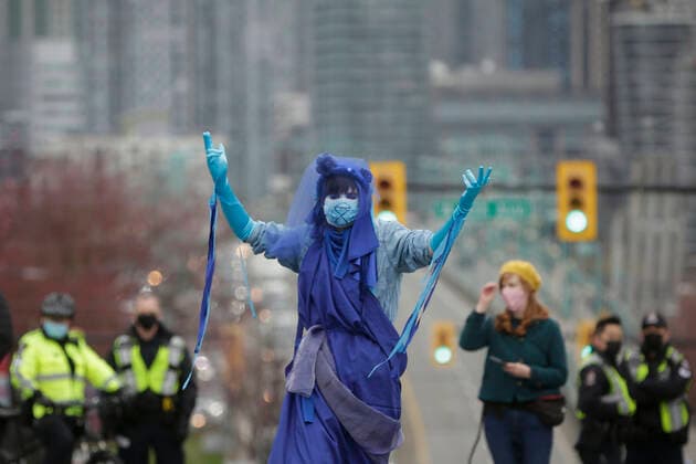 (210327) -- VANCOUVER, March 27, 2021 -- A woman takes part in a climate change protest in Vancouver, British Columbia, Canada, on March 27, 2021. (Photo by Xinhua) CANADA-VANCOUVER-CLIMATE CHANGE-PROTEST LiangxSen 