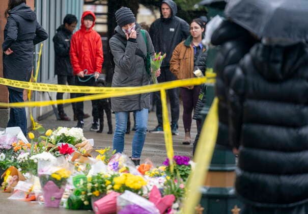 March 28, 2021, North Vancouver, BC, Canada: People lay flowers at a makeshift memorial outside of the Lynn Valley Library in North Vancouver, B.C., Sunday, March 28, 2021. The memorial is for stabbing victims that were attacked by a man with a knife on Saturday, sending several to hospital and leaving one dead. North Vancouver Canada  - ZUMAc35_ 20210328_zaf_c35_038 Copyright: xJonathanxHaywardx