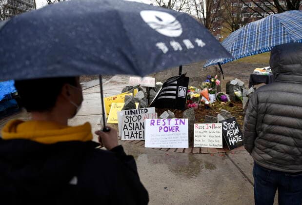 March 28, 2021, Ottawa, on, Canada: Community members gather in the rain at the Ottawa Women s Monument in Minto Park for a vigil in memory of the victims of the Atlanta spa shootings and to rally against anti-Asian racism, in Ottawa, on Sunday, March 28, 2021. Ottawa Canada  - ZUMAc35_ 20210328_zaf_c35_062 Copyright: xJustinxTangx