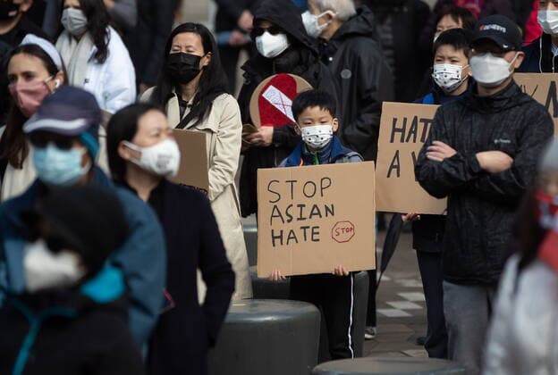 March 28, 2021, Vancouver, BC, Canada: A young boy holds a sign during a rally opposing discrimination against Asian communities and to mourn the victims of those affected by the Atlanta shootings, in Vancouver, B.C., on Sunday, March 28, 2021. Vancouver Canada  - ZUMAc35_ 20210328_zaf_c35_146 Copyright: xDarrylxDyckx