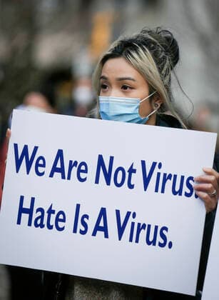(210328) -- VANCOUVER, March 28, 2021 -- A woman holds a placard during a Stop Asian Hate rally in Vancouver, British Columbia, Canada, on March 28, 2021. Hundreds of people took part in the rally against the racism toward Asians here on Sunday. (Photo by Xinhua) CANADA-VANCOUVER-RALLY-STOP ASIAN HATE LiangxSen 