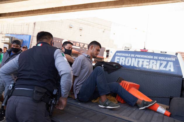 March 28, 2021, Tijuana, Mexico: A migrant is arrested by Mexico Police. Migrants from Central America are stuck living in tents on the street in Tijuana, Mexico on the border while they wait for President Joe Biden to open the American border. Tijuana Mexico - ZUMAd211 20210328_zap_d211_006 Copyright: xAllisonxDinnerx