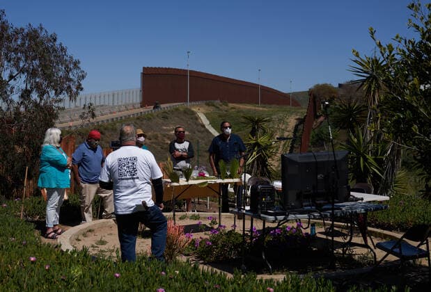 March 28, 2021, Tijuana, Mexico: Pasteur Guillermo Navarrete held a special Palm Sunday mass for the start of Holy Week at a section of the border wall that he has found access to. Normally migrants are in attendance, but due to COVID-19 the mass was live streamed on Facebook and Zoom for migrants to tune in. Tijuana Mexico - ZUMAd211 20210328_zap_d211_033 Copyright: xAllisonxDinnerx