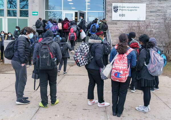 March 29, 2021, Montreal, PQ, Canada: Students enter the Pierre Laporte Secondary School as secondary school students return to class full time during the COVID-19 pandemic in Montreal, on Monday, March 29, 2021. Montreal Canada  - ZUMAc35_ 20210329_zaf_c35_007 Copyright: xPaulxChiassonx