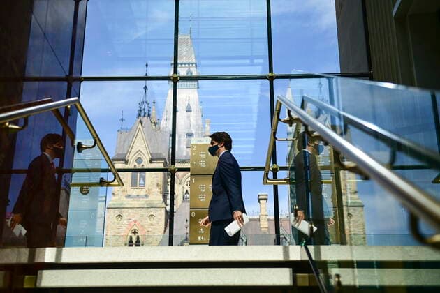 March 30, 2021, Ottawa, on, Canada: Prime Minister Justin Trudeau makes his way to hold a press conference during the COVID-19 pandemic in Ottawa on Tuesday, March 30, 2021. Ottawa Canada  - ZUMAc35_ 20210330_zaf_c35_025 Copyright: xSeanxKilpatrickx