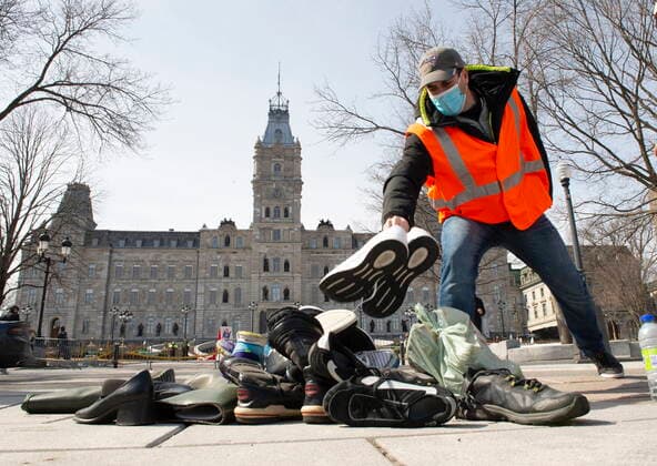 March 30, 2021, QUEBEC, PQ, Canada: SCFP union workers pile up shoes in front of the National Assembly as demonstrators drive around in their cars, Tuesday, March 30, 2021 in Quebec City. Union workers claim negotiations are at a standstill and give it as the reason to drop shoes. QUEBEC Canada  - ZUMAc35_ 20210330_zaf_c35_028 Copyright: xJacquesxBoissinotx