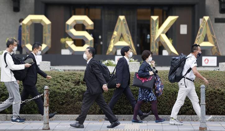 Scene of Osaka amid coronavirus pandemic People wearing face masks walk in Osaka on April 2, 2021, amid a resurgence in coronavirus infections in the western Japan prefecture. 