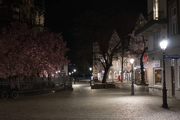 Like an abandoned city. Aachen on Easter vigil between 10 p.m. and 11 p.m. View of the deserted pedestrian zone Muensterplatz. In Aachen on April 3, 2021. GERMANY - AACHEN - EASTER Easter 2021 Covid Pandemic