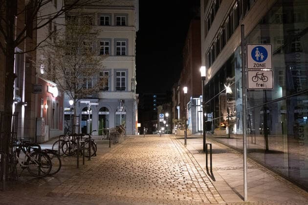 Like an abandoned city. Aachen on Easter vigil between 10 p.m. and 11 p.m. View into the deserted pedestrian zone Rennbahn-Strasse. In Aachen on April 3, 2021. GERMANY - AACHEN - EASTER Easter 2021 Covid Pandemic