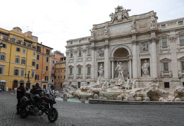 (210404) -- ROME, April 4, 2021 -- Carabinieri officers patrol at Fontana di Trevi in Rome, Italy, April 3, 2021. Italy is spending Easter in lockdown after the government made the whole nation a COVID-19 red zone from Saturday to Easter Monday. ) ITALY-ROME-EASTER-LOCKDOWN ChengxTingting 
