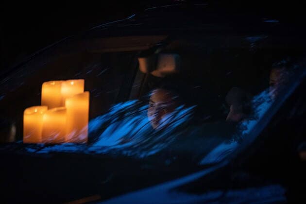 April 3, 2021, North Vancouver, BC, Canada: A young passenger watches from inside a vehicle with candles on the dashboard during a drive-thru candlelight vigil for the victims of last week s mass stabbing incident in and around the Lynn Valley Library, at Lynn Canyon Park in North Vancouver, B.C., on Saturday, April 3, 2021. North Vancouver Canada  - ZUMAc35_ 20210403_zaf_c35_102 Copyright: xDarrylxDyckx