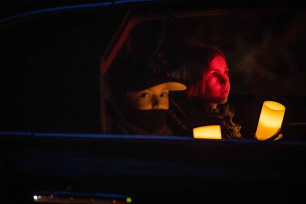 April 3, 2021, North Vancouver, BC, Canada: Children sitting in the back of a vehicle hold LED candles during a drive-thru candlelight vigil for the victims of last week s mass stabbing incident in and around the Lynn Valley Library, at Lynn Canyon Park in North Vancouver, B.C., on Saturday, April 3, 2021. North Vancouver Canada  - ZUMAc35_ 20210403_zaf_c35_110 Copyright: xDarrylxDyckx