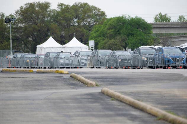 April 03, 2021: Mass drive-thru vaccination site at the Toney Burger Activity Center in South Austin, vehicles wait in line on Saturday evening. Austin, Texas. CSM. Austin United States of America - ZUMAc04_ 1001932927st Copyright: xMarioxCantux