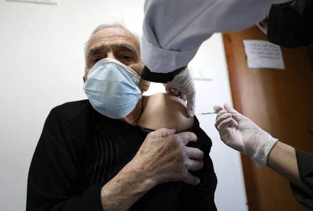 (210404) -- NABLUS, April 4, 2021 -- A man receives a dose of Sinopharm COVID-19 vaccine during a vaccination campaign in the West Bank city of Nablus, April 4, 2021. China on March 29 handed over a batch of donated Sinopharm COVID-19 vaccines to Palestine to support its nationwide fight against the pandemic. (Photo by Xinhua) MIDEAST-NABLUS-SINOPHARM-COVID-19-VACCINATION AymanxNobani 