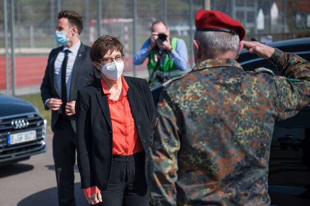 The vaccination center of the German Federal Armed Forces starts the around the clock vaccination enterprise The Federal Minister of Defense Annegret Kramp Karrenbauer red blouse gives together with Prime Minister Tobias Hans blue suit and Health Minister Monika Bachmann blazer pink on Easter Sunday 04 04 2021 the starting signal for the extended operating times in the bub