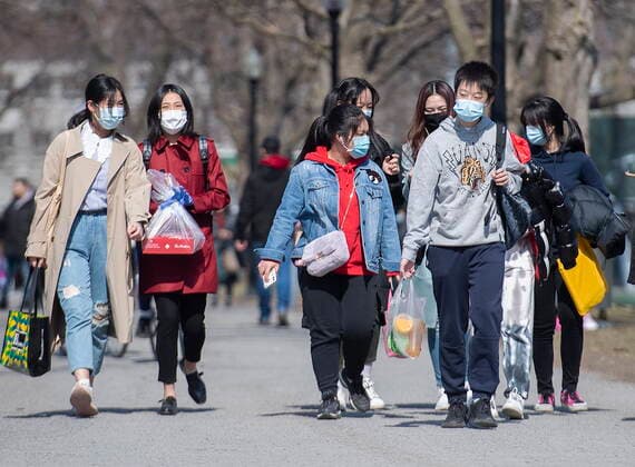 April 4, 2021, Montreal, PQ, Canada: People wear face masks as they walk in a park in Montreal, Sunday, April 4, 2021, as the COVID-19 pandemic continues in Canada and around the world. Montreal Canada  - ZUMAc35_ 20210404_zaf_c35_061 Copyright: xGrahamxHughesx