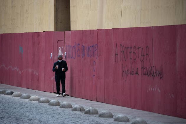 April 4, 2021, Santiago, Metropolitana, Chile: A man with a mask walks down an empty street in the center of Santiago, in the midst of the total quarantine decreed last week for the Metropolitan Region, due to the second wave of coronavirus that is collapsing the health system. Santiago Chile - ZUMAb332 20210404_zip_b332_002 Copyright: xMatiasxBasualdox