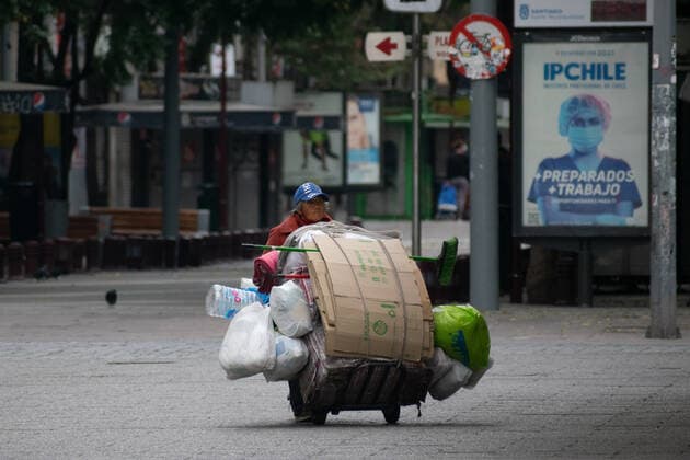 April 4, 2021, Santiago, Metropolitana, Chile: A woman in a homeless situation walks through the empty streets of downtown Santiago, in the midst of the total quarantine decreed last week for the Metropolitan Region. Santiago Chile - ZUMAb332 20210404_zip_b332_017 Copyright: xMatiasxBasualdox