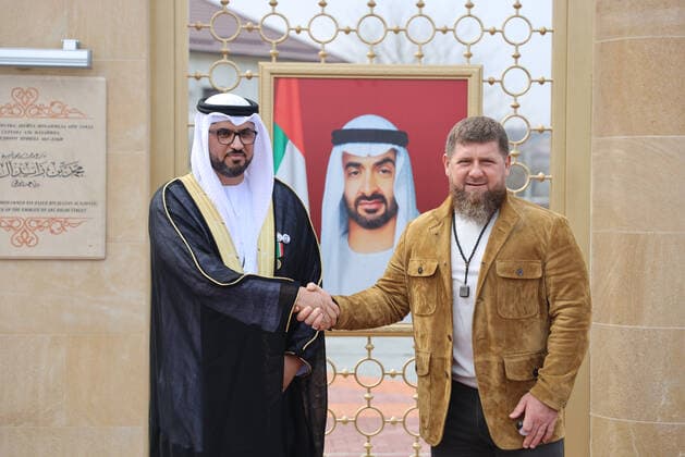 GROZNY, RUSSIA - APRIL 5, 2021: UAE Ambassador to Russia Mohammed Ahmed Al Jaber (L) and Chechnya Head Ramzan Kadyrov shake hands during the unveiling of a stele with a portrait of Sheikh Mohammed bin Zayed Al Nahyan, Crown Prince of Abu Dhabi, in a street renamed in his honor. Taisiya Borshigova TASS  TS0FBA84
