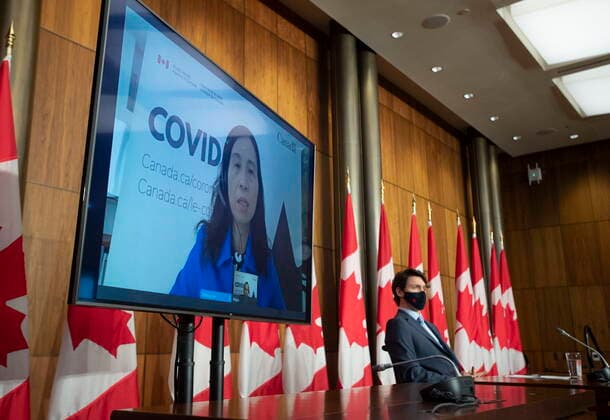 April 6, 2021, Ottawa, on, Canada: Prime Minister Justin Trudeau looks on as Chief Public Health Officer Theresa Tam appears via videoconference at a news conference on the COVID-19 pandemic, Tuesday April 6, 2021 in Ottawa. Ottawa Canada  - ZUMAc35_ 20210406_zaf_c35_017 Copyright: xAdrianxWyldx