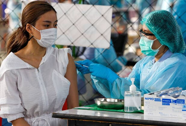 April 7, 2021, Bangkok, Thailand: A woman wearing face mask receives a dose of the CoronaVac (Sinovac) vaccine..Several cabinet ministers and all Bhumjaithai Party MPs have begun 14-day quarantine after being in close contact with new Covid-19 cases. Bangkok Thailand - ZUMAs197 20210407_zaa_s197_026 Copyright: xChaiwatxSubprasomx