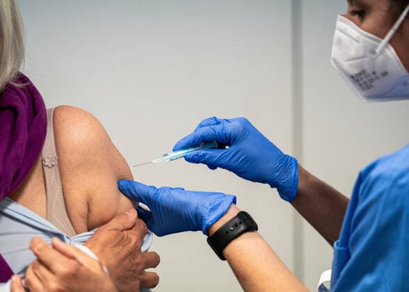 (210407) -- CORNELLA, April 7, 2021 -- A resident receives a dose of AstraZeneca COVID-19 vaccine at a vaccination site in Cornella, Spain, April 7, 2021. The European Medicines Agency (EMA) confirmed on Wednesday that the occurrence of blood clots with low blood platelets are strongly associated with the administration of AstraZeneca COVID-19 vaccine, but should be still listed as very rare side effects. (Photo by Xinhua) SPAIN-CORNELLA-ASTRAZENECA COVID-19 VACCINE JoanxGosa 