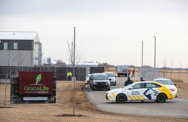 April 7, 2021, EDMONTON, ab, Canada: Security and police block the entrance to GraceLife Church as a fence goes up around it near Edmonton on Wednesday April 7, 2021. The Alberta government has closed down and fenced off a church that has been charged with refusing to follow COVID-19 health rules. Alberta Health Services, in a statement, says GraceLife church will remain closed until it shows it will comply with public-health measures meant to contain the spread of the novel coronavirus. EDMONTON Canada  - ZUMAc35_ 20210407_zaf_c35_064 Copyright: xJasonxFransonx