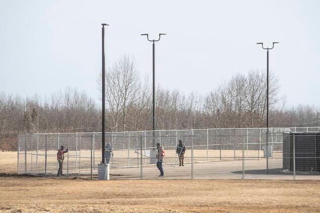 April 7, 2021, EDMONTON, ab, Canada: A fence goes up around GraceLife Church near Edmonton on Wednesday April 7, 2021. The Alberta government has closed down and fenced off a church that has been charged with refusing to follow COVID-19 health rules. Alberta Health Services, in a statement, says GraceLife church will remain closed until it shows it will comply with public-health measures meant to contain the spread of the novel coronavirus. EDMONTON Canada  - ZUMAc35_ 20210407_zaf_c35_065 Copyright: xJasonxFransonx