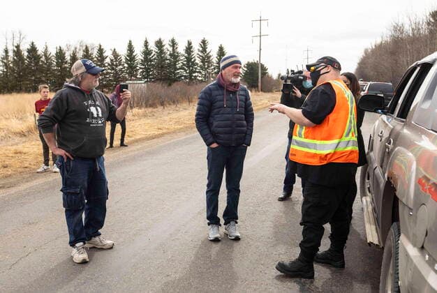 April 7, 2021, EDMONTON, ab, Canada: GraceLife Church supporters argue with a non supporter near Edmonton on Wednesday April 7, 2021. The Alberta government has closed down and fenced off a church that has been charged with refusing to follow COVID-19 health rules. Alberta Health Services, in a statement, says GraceLife church will remain closed until it shows it will comply with public-health measures meant to contain the spread of the novel coronavirus. EDMONTON Canada  - ZUMAc35_ 20210407_zaf_c35_095 Copyright: xJasonxFransonx