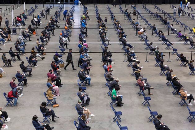 April 7, 2021, Seattle, Washington, USA: Patients wait in the observation area after receiving the first dose of the PfizerÃ¢â‚¬BioNTech COVID-19 vaccine at the Lumen Field Event Center in Seattle on Wednesday, April 7, 2021. The City of Seattle administered a record 7,615 doses of vaccine at the site on Wednesday. Seattle USA - ZUMAg235 20210407_zap_g235_008 Copyright: xPaulxChristianxGordonx