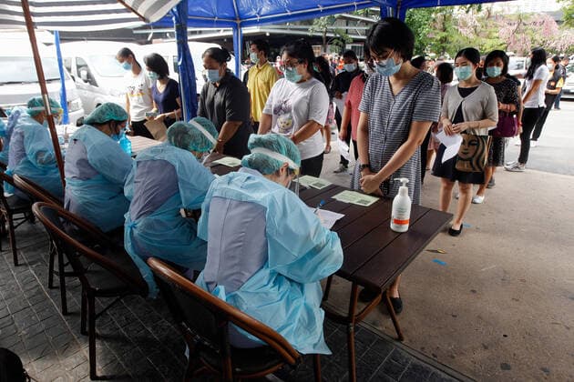 April 8, 2021, Bangkok, Thailand: People in a queue for verification of their documents during a swab test drive outside a nightclub in Bangkok..The Ministry of Public Health is set to recommend the closure of night entertainment spots in high-risk areas of Bangkok, in order to deal with the fast-spreading UK variant of the coronavirus. The UK variant is believed to have played a significant role in the spread of the latest cluster of infections detected at entertainment venues across the capital. Bangkok Thailand - ZUMAs197 20210408_zaa_s197_015 Copyright: xChaiwatxSubprasomx