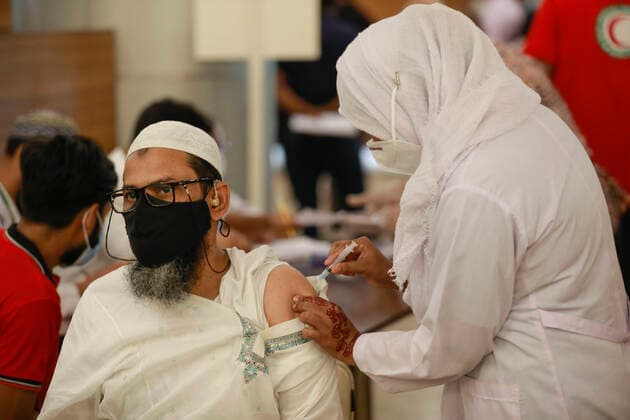 April 8, 2021, Dhaka, Bangladesh: A man receives a dose of Covid-19 coronavirus vaccine during second phase of Covid-19 vaccination drive at the Bangabandhu Sheikh Mujib Medical University (BSMMU) in Dhaka, Bangladesh, April 8, 2021. The government is supposed to get 5 million doses of the Oxford-AstraZeneca vaccine every month as per a deal between India s Serum Institute and Bangladeshi pharma company Beximco. The country has so far received two shipments of 7 million doses of the Covid-19 vaccine. Apart from this, Bangladesh received two consignments of 3.2 million doses of the vaccine as gifts from India. Dhaka Bangladesh - ZUMAd117 20210408_zap_d117_007 Copyright: xSuvraxKantixDasx