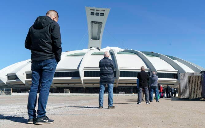 April 8, 2021, Montreal, PQ, Canada: People wait in line at a COVID-19 vaccination clinic to receive the AstraZeneca vaccine at Olympic Stadium in Montreal, on Thursday, April 8, 2021. Quebecers 55 and over can now get the AstraZeneca vaccine at walk-in clinics across the province. Montreal Canada  - ZUMAc35_ 20210408_zaf_c35_010 Copyright: xPaulxChiassonx