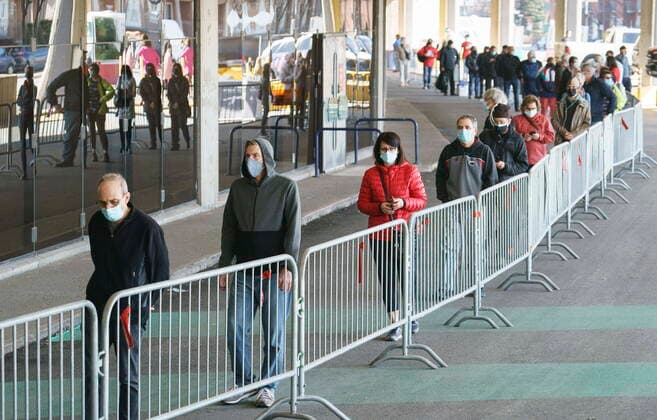 April 8, 2021, Montreal, PQ, Canada: People wait in line at a COVID-19 vaccination clinic to receive the AstraZeneca vaccine at Olympic Stadium in Montreal, on Thursday, April 8, 2021. Quebecers 55 and over can now get the AstraZeneca vaccine at walk-in clinics across the province. Montreal Canada  - ZUMAc35_ 20210408_zaf_c35_011 Copyright: xPaulxChiassonx