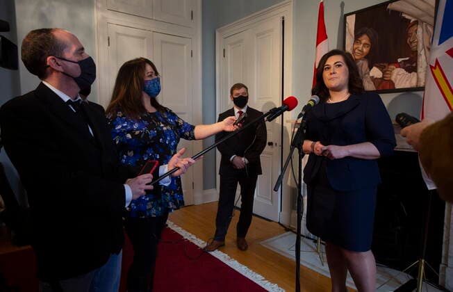 April 8, 2021, St. John s, NL, Canada: Newfoundland and Labrador Premier Andrew Furey looks on as Minister of Municipal and Provincial Affairs and Registrar General Krista Lynn Howell speaks to media following the government s swearing in ceremony, at Government House in St. John s, Thursday, April 8, 2021. St. John s Canada  - ZUMAc35_ 20210408_zaf_c35_047 Copyright: xPaulxDalyx
