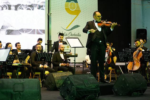 April 8, 2021, Mosul, Nineveh, Iraq: Members of the Watar orchestra playing for the first time on the grounds of the Spring Theatre Hall, which was destroyed during the ISIS occupation in the city..The Watar orchestral includes 36 young men and women from different denominations of Nineveh Governorate, including Muslims, Christians and Yazidis, whose ages range between 8-32 years. Mosul Iraq - ZUMAs197 20210408_zaa_s197_166 Copyright: xIsmaelxAdnanx