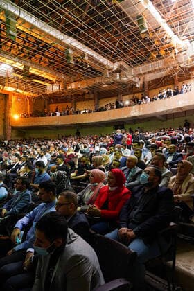 April 8, 2021, Mosul, Nineveh, Iraq: The audience during a performance by the Watar orchestral, playing for the first time on the grounds of the Spring Theatre Hall, which was destroyed during the ISIS occupation in the city..The Watar orchestral includes 36 young men and women from different denominations of Nineveh Governorate, including Muslims, Christians and Yazidis, whose ages range between 8-32 years. Mosul Iraq - ZUMAs197 20210408_zaa_s197_164 Copyright: xIsmaelxAdnanx